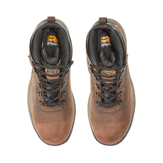 Pair of brown leather boots with laces on a white background