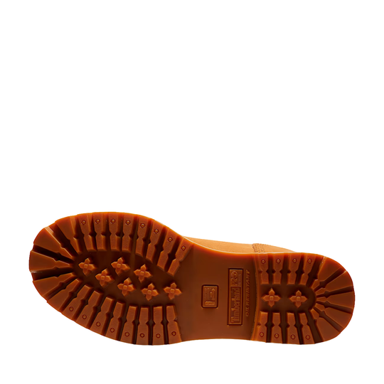 Brown boot sole with tread pattern on a white background