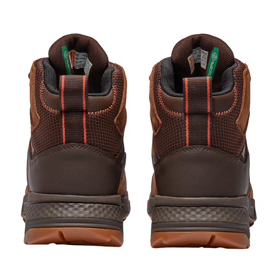Pair of brown hiking boots with visible brand labels on a white background