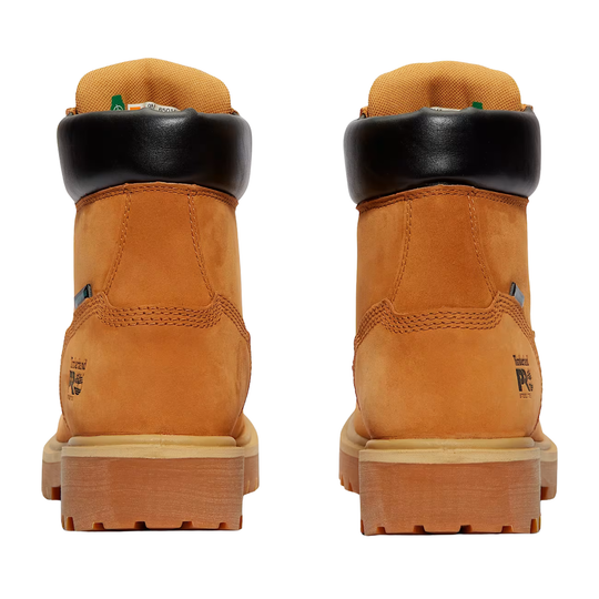 Pair of tan work boots with black soles on a white background