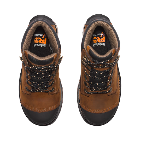 Pair of brown work boots with black soles on a white background