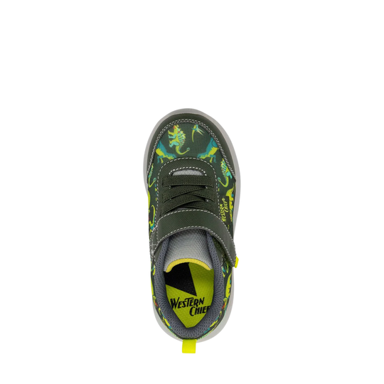 Green sneaker with dinosaur pattern on a white background