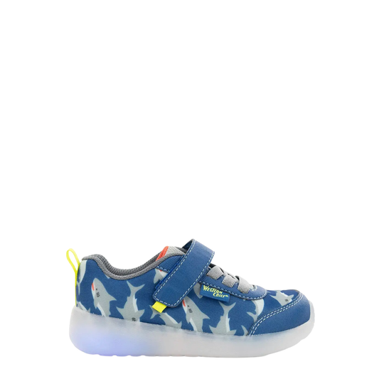 Blue children's sneaker with dog pattern on a white background