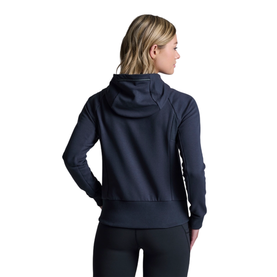 Person wearing a navy blue hoodie on a white background