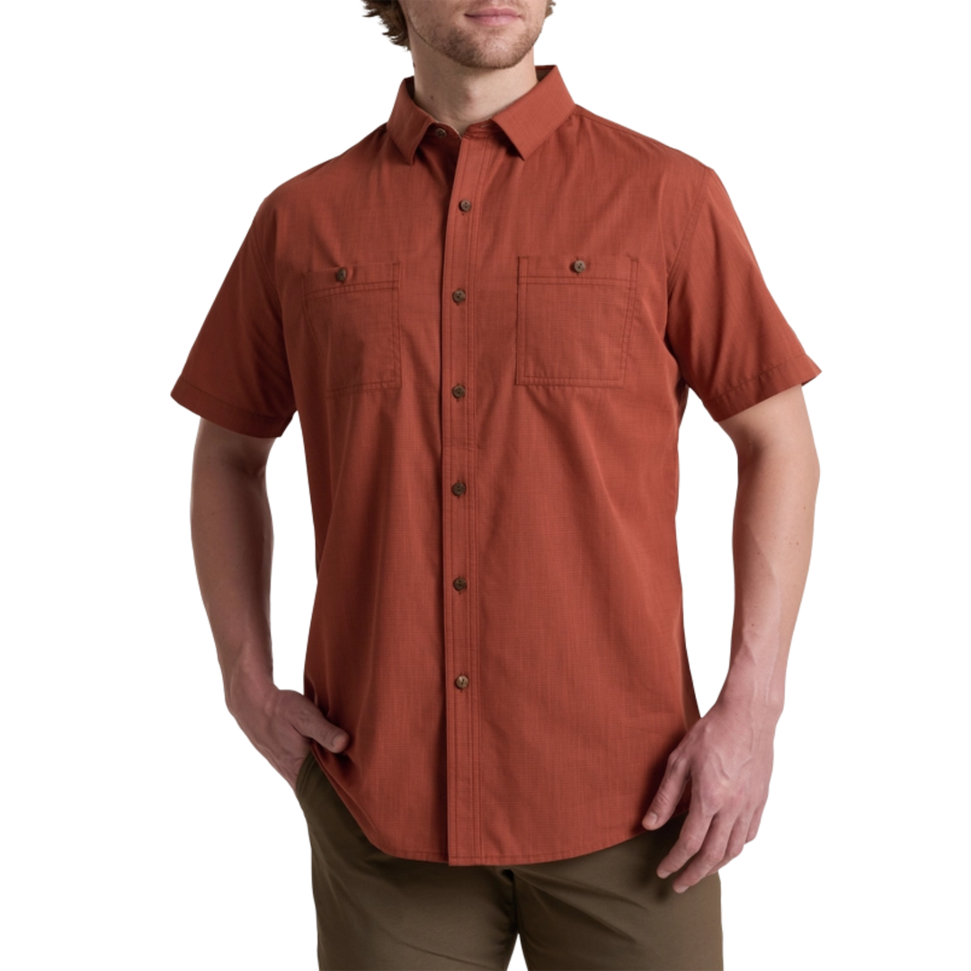 Man wearing a short-sleeve button-up shirt on a white background