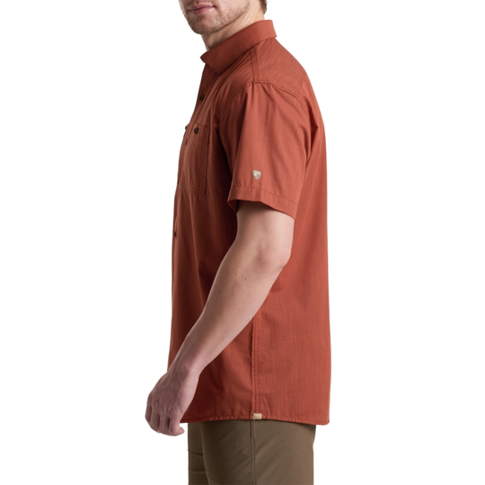 Man wearing a brown short-sleeve shirt on a white background