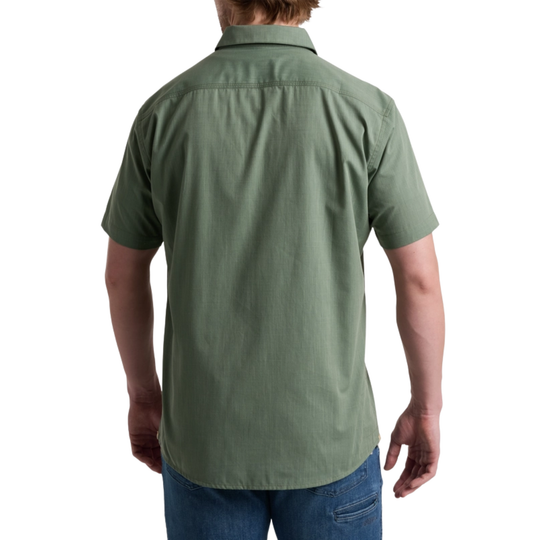 Person wearing a green short-sleeve shirt on a white background