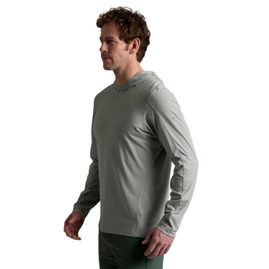 Man wearing a gray long-sleeve shirt on a white background