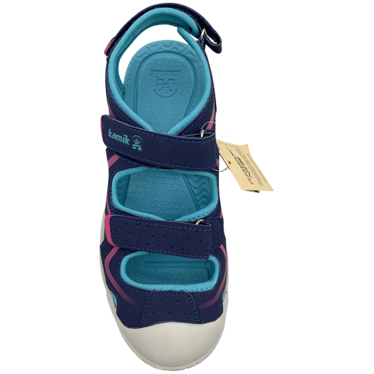 Navy and blue sandal with a visible brand tag on a white background