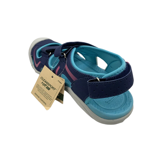 Pair of blue sandals with a tag on a white background