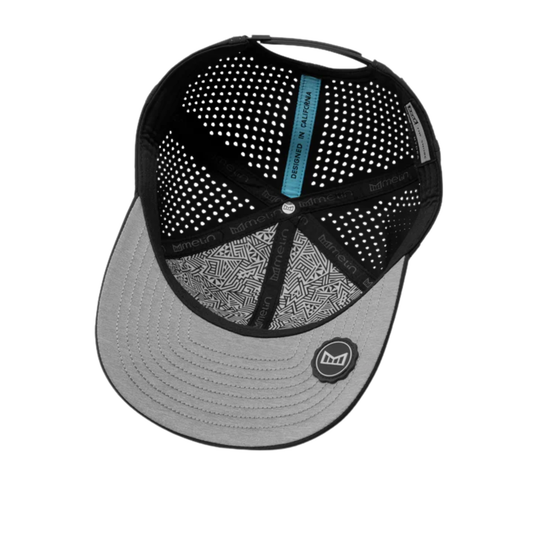 Black and gray cap with patterned interior on a white background
