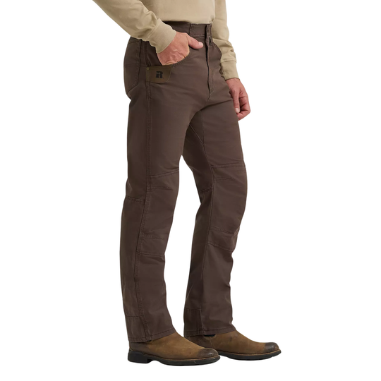 Brown pants worn by a person on a white background