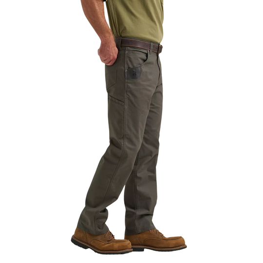 Person wearing green shirt, gray pants, and brown boots on a white background