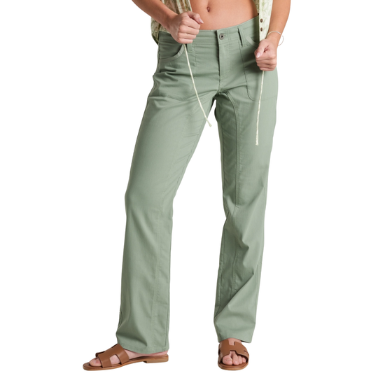Person wearing light green pants on a white background