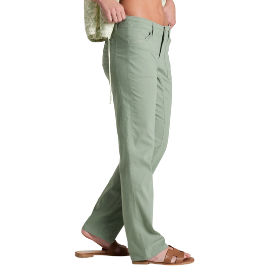 Green pants worn by a person on a white background