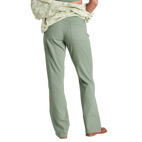 Green pants worn by a person on a white background