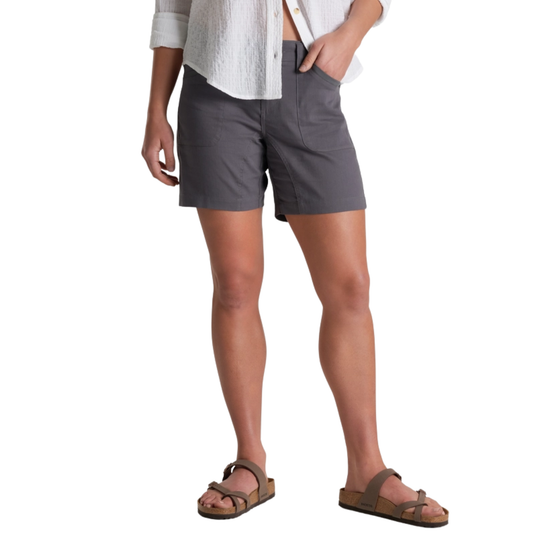 Person wearing gray shorts on a white background