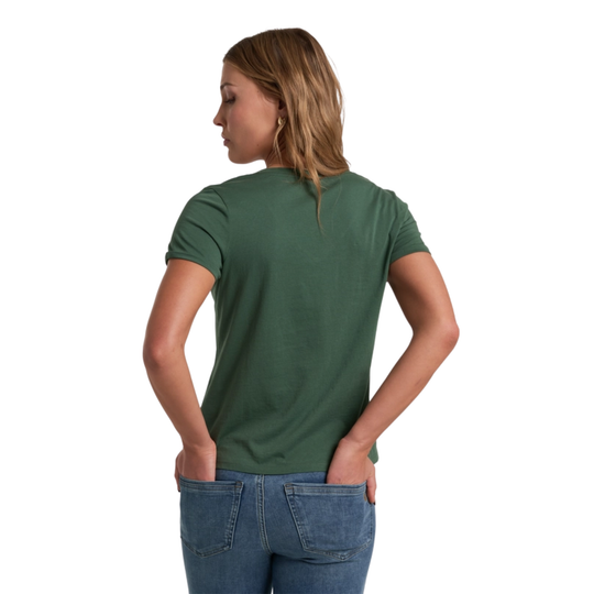 Woman wearing a green t-shirt and blue jeans on a white background