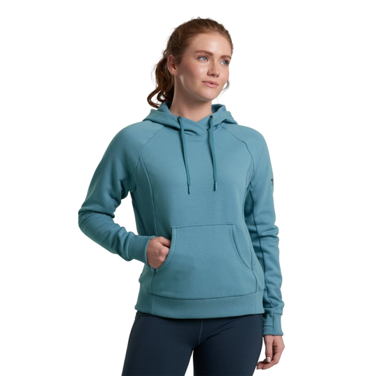 Woman wearing a teal hoodie on a white background