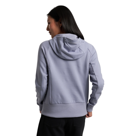 Person wearing a light gray hoodie on a white background