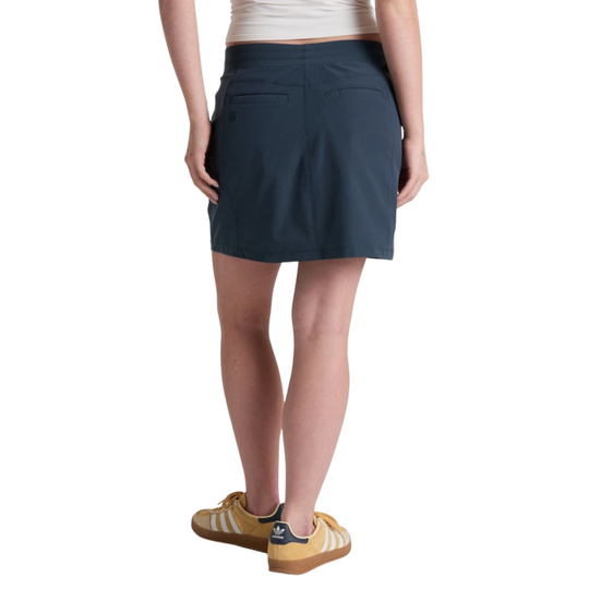 Person wearing a navy blue skirt on a white background
