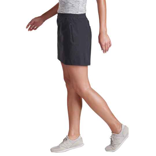Person wearing a black skirt on a white background