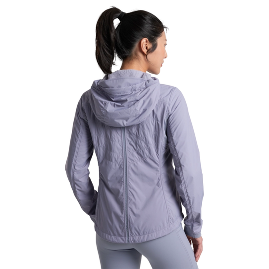 Person wearing a light purple jacket on a white background