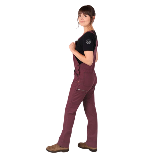 Person wearing a maroon jumpsuit on a white background