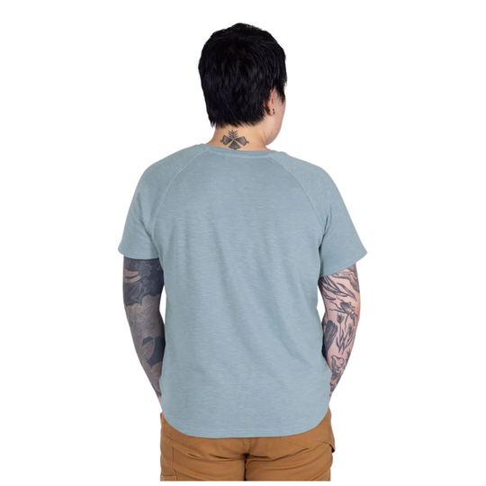 Person wearing a light blue t-shirt on a white background