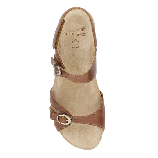Brown sandal with strap on a white background