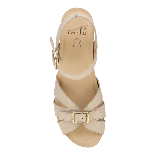 Beige sandal with a gold buckle on a white background, featuring the Danskas brand.