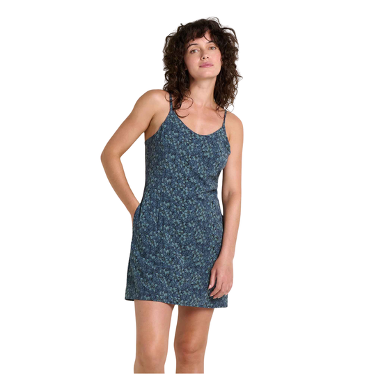 Woman wearing a blue floral dress on a white background