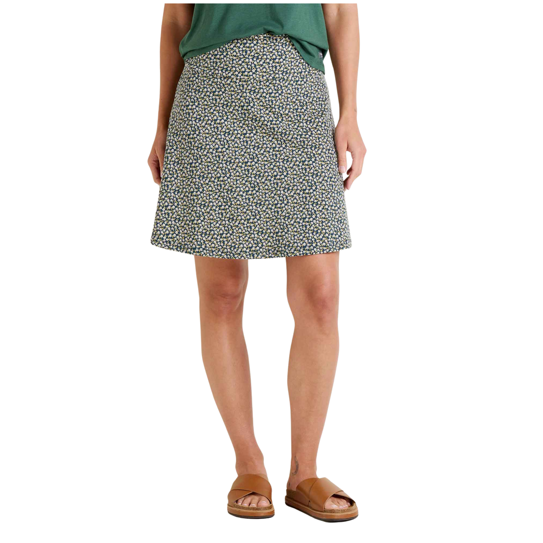 Person wearing a patterned skirt on a white background
