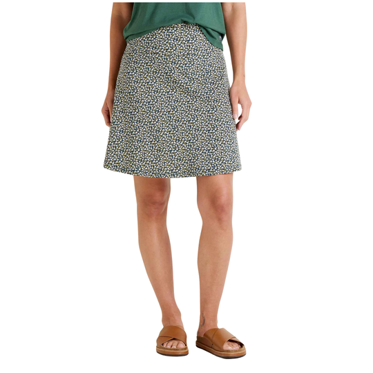 Person wearing a patterned skirt on a white background