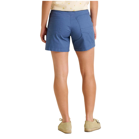 Blue shorts worn by a person on a white background