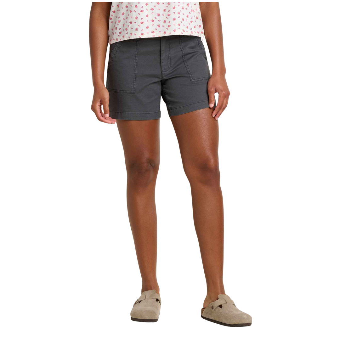 Person wearing gray shorts on a white background