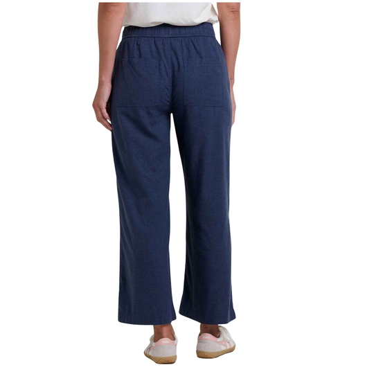 Person wearing blue pants on a white background