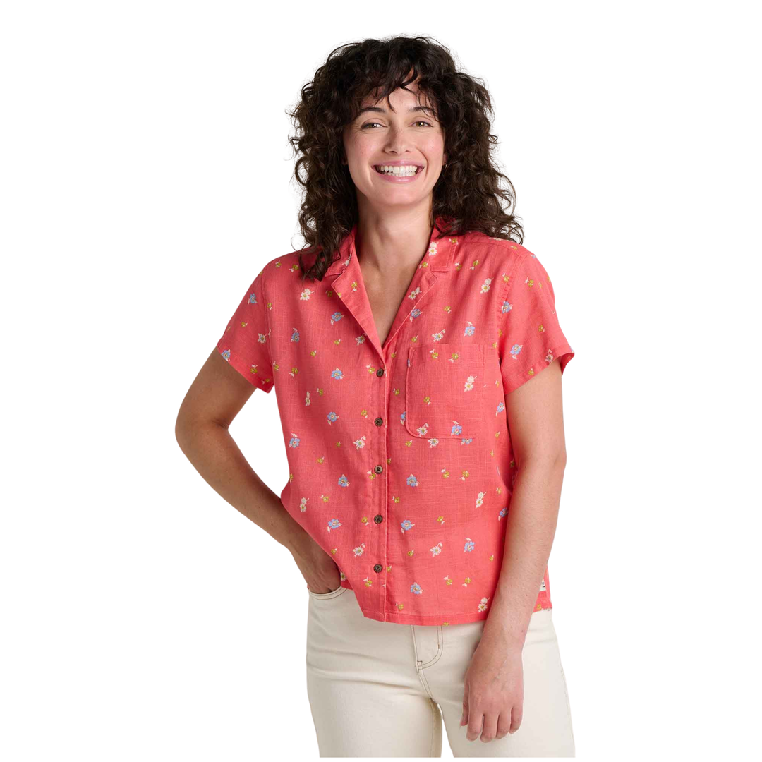 Woman wearing a red patterned shirt on a white background