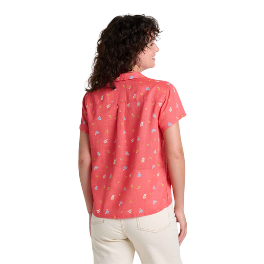 Woman wearing a red patterned shirt on a white background