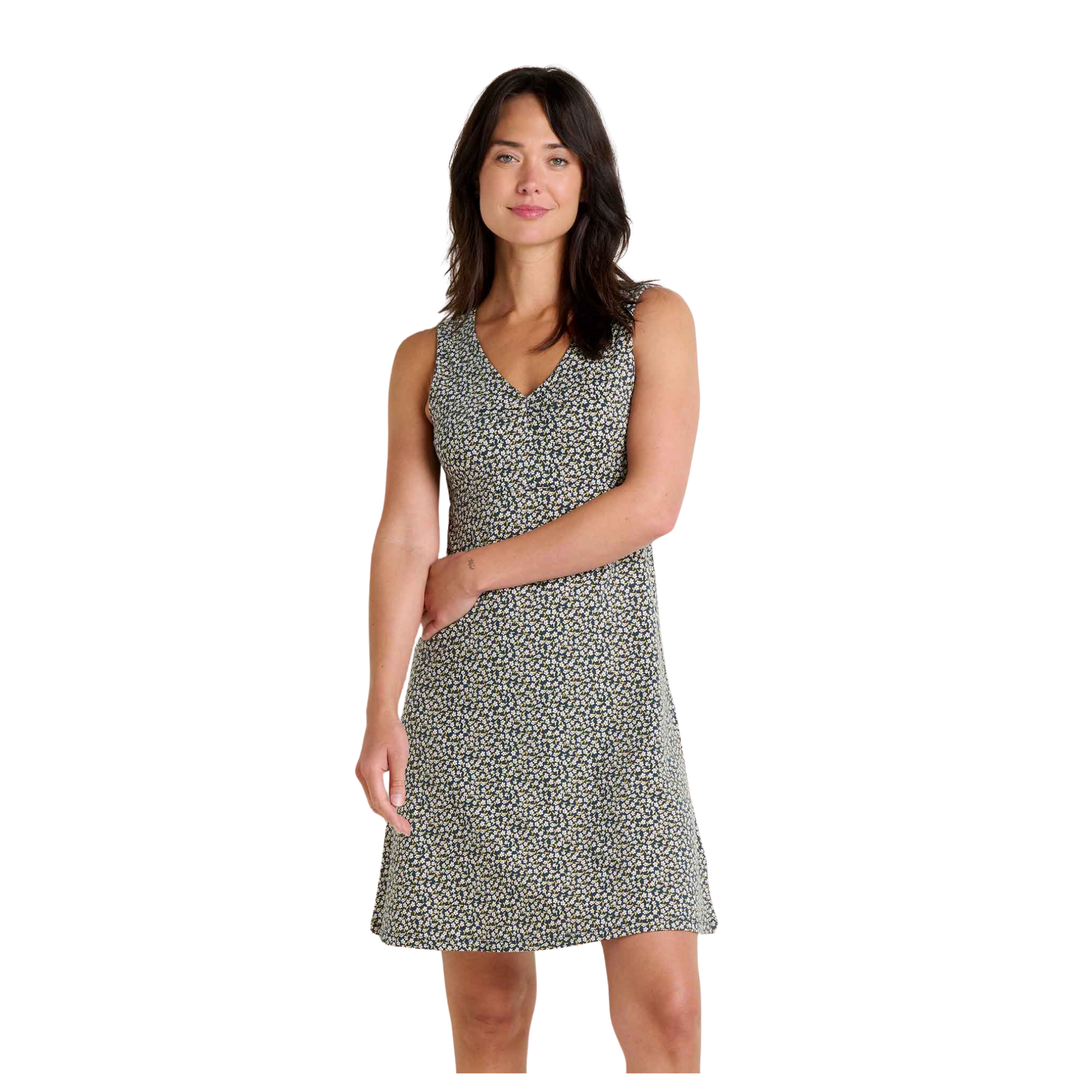 Woman wearing a sleeveless patterned dress on a white background