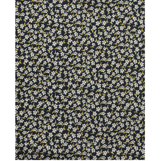 Floral patterned fabric with small white flowers on a dark blue background