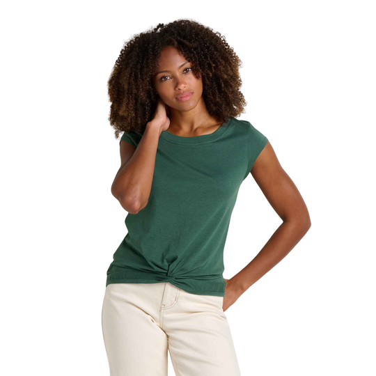 Woman wearing a green top with a knot detail on a white background