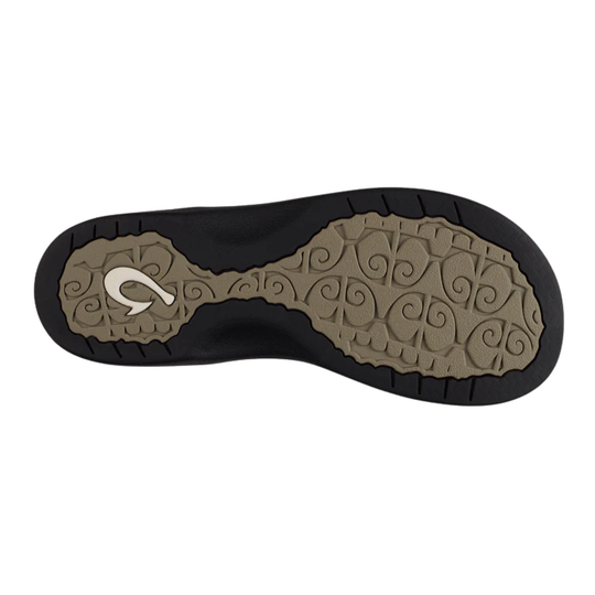 Close-up of a shoe sole with a brand logo on a white background