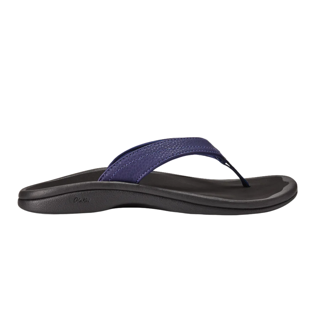 Black sandal with a blue strap on a white background