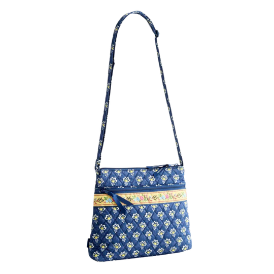 Blue floral-patterned shoulder bag with a yellow strap on a white background