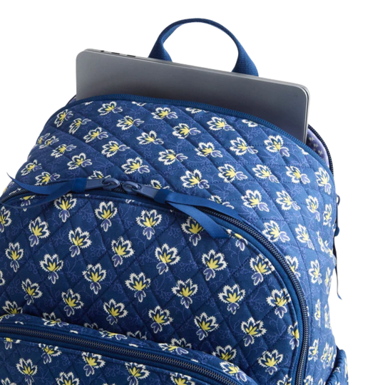 Blue floral-patterned backpack with laptop pocket on a white background