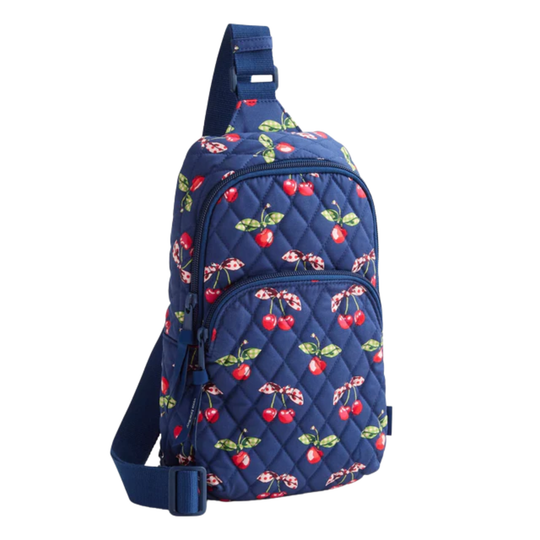 Navy blue sling bag with cherry pattern on a white background