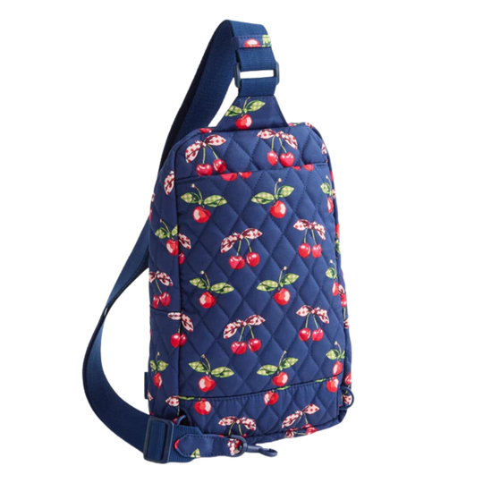 Navy blue sling bag with cherry pattern on a white background