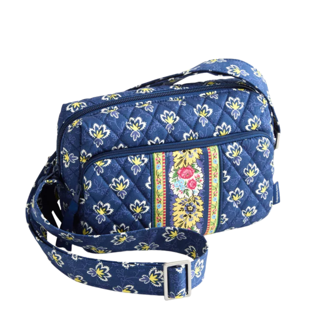 Blue floral-patterned cosmetic bag on a white background