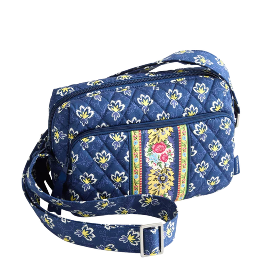 Blue floral-patterned cosmetic bag on a white background